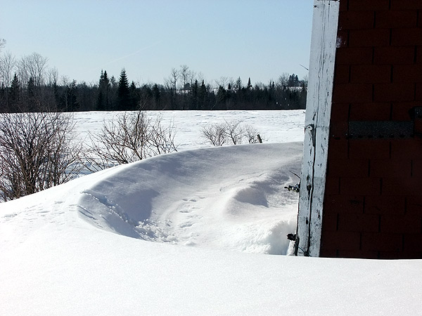 Maine Circle Of Snow Swirls Decorate A Farm Yard. Maine Snow Patterns Due To Whatever Building Is In The Way Of Winter.